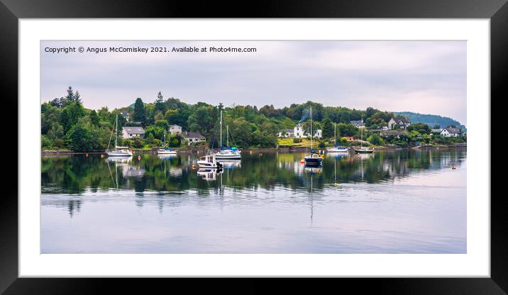 Yachts anchored at North Connel village Framed Mounted Print by Angus McComiskey