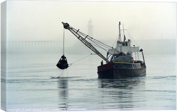 Dredger working in Whitby Harbour Canvas Print by Keith Bowser