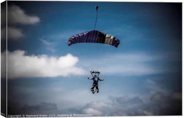 Skydiver parachutist descending  Canvas Print by Raymond Evans