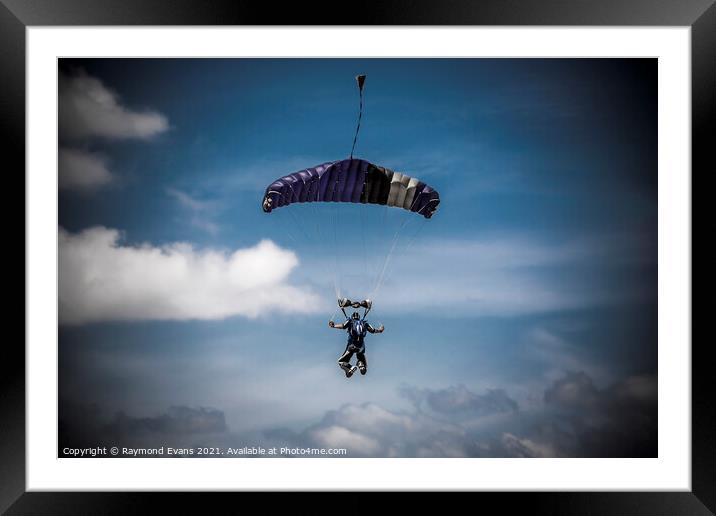 Skydiver parachutist descending  Framed Mounted Print by Raymond Evans