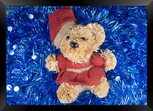 Teddy bear on blue tinsel Framed Print by aurélie le moigne