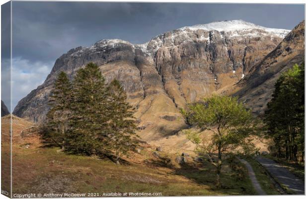 Snow capped scottish highlands Canvas Print by Anthony McGeever