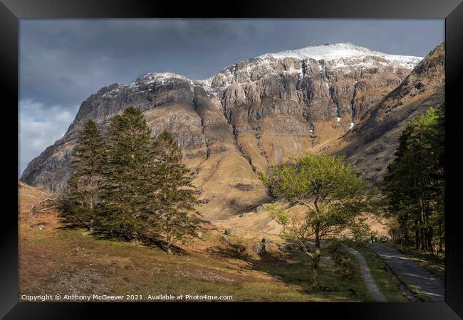 Snow capped scottish highlands Framed Print by Anthony McGeever