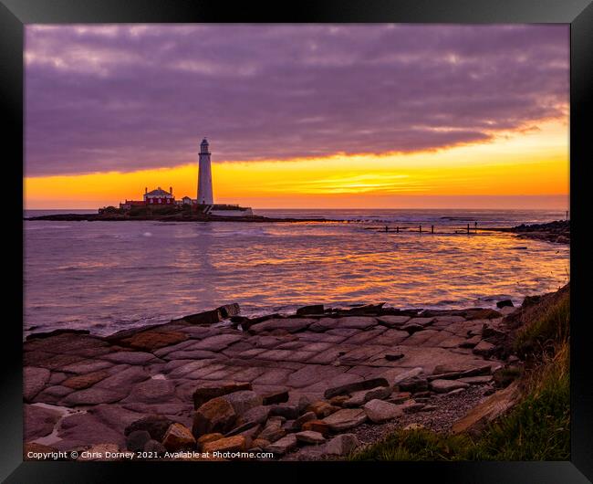 Sunrise at St. Marys Lighthouse in Northumberland, UK Framed Print by Chris Dorney