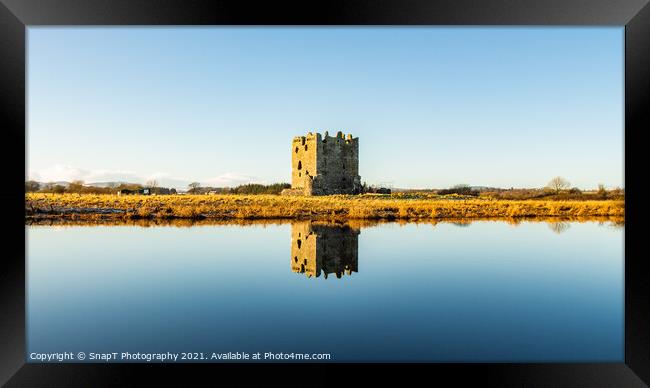 Threave Castle reflecting on the River Dee in the winter sun and ground frost Framed Print by SnapT Photography
