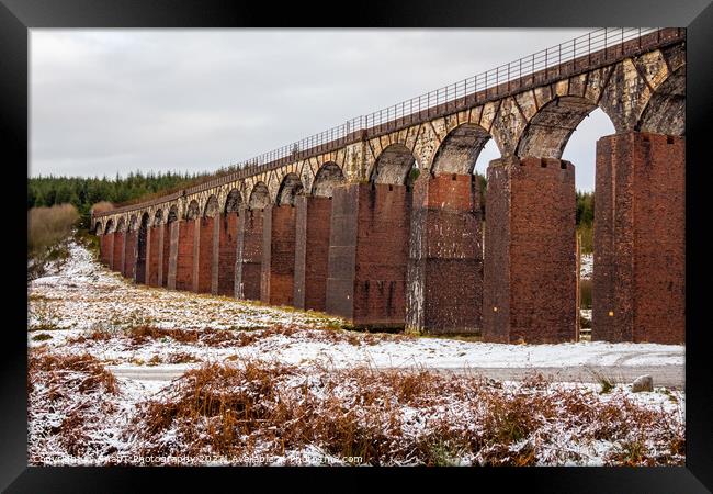 A snow covered landscape at the old railway viaduct at the Big Water of Fleet Framed Print by SnapT Photography