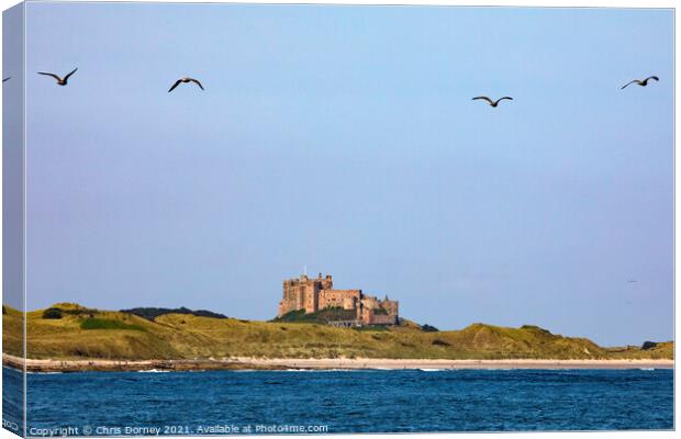 Bamburgh Castle in Northumberland, UK Canvas Print by Chris Dorney