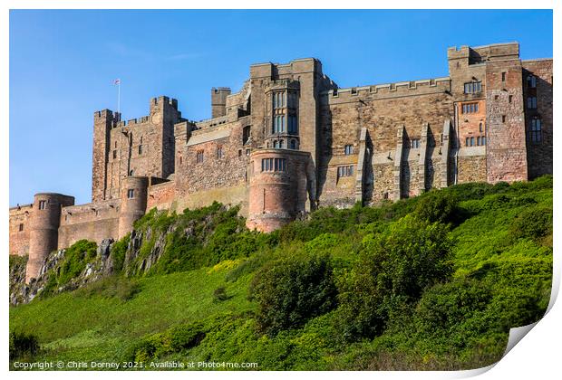 Bamburgh Castle in Northumberland, UK Print by Chris Dorney