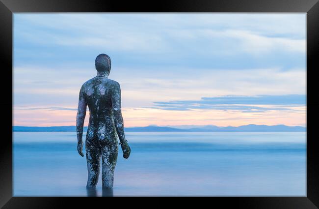 Iron Man surrounded in water at twilight Framed Print by Jason Wells