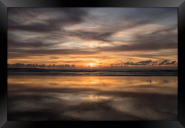 Moody sunset reflections at Westward Ho! Framed Print by Tony Twyman