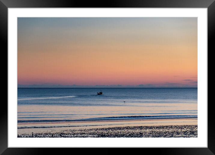 A fishing boat sailing into the sunrise Framed Mounted Print by Dave Cocks