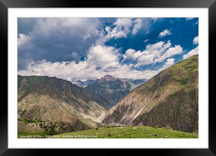 A beautiful shot of mountains under the cloudy sky Framed Mounted Print by Frank Bach