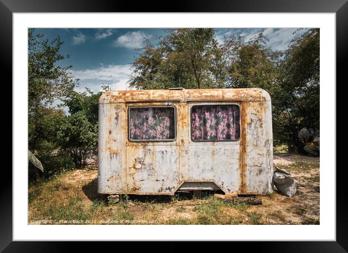 A closeup shot of a rusty wagon as a shelter Framed Mounted Print by Frank Bach