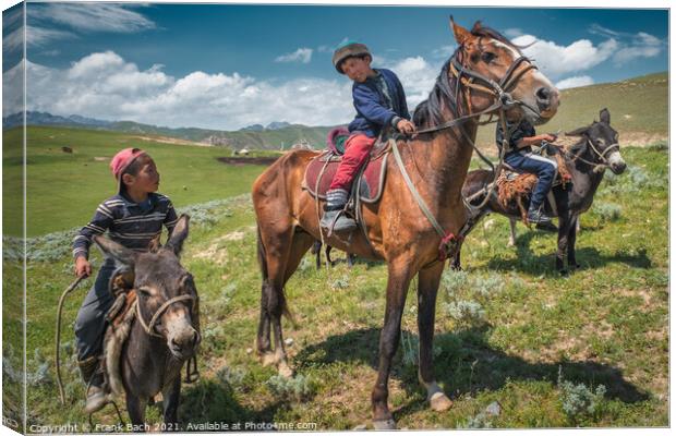 Closeup shot of children on horses and donkeys in Kyrgyzstan Canvas Print by Frank Bach