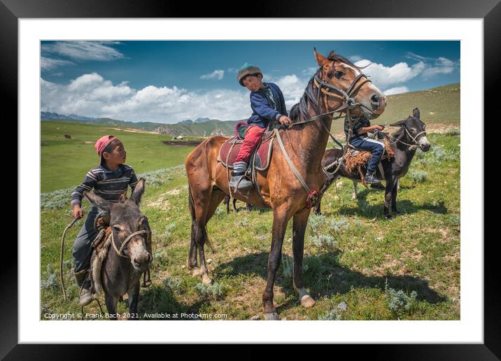 Closeup shot of children on horses and donkeys in Kyrgyzstan Framed Mounted Print by Frank Bach