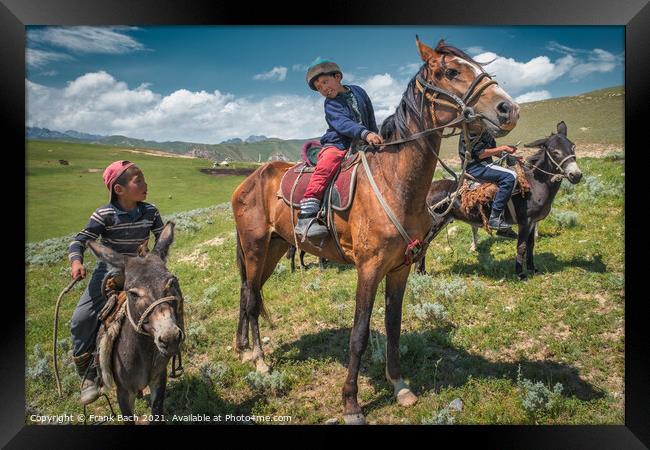 Closeup shot of children on horses and donkeys in Kyrgyzstan Framed Print by Frank Bach