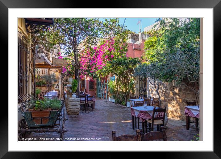 Outdoor restaurant in Chania Framed Mounted Print by Kevin Hellon