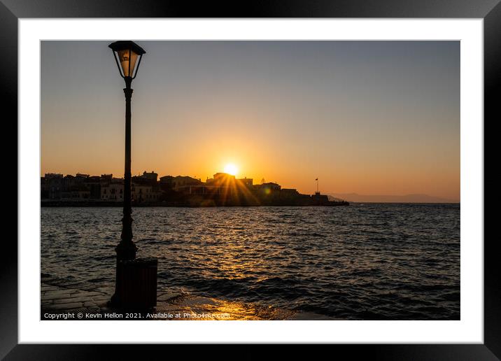 Sun setting over the Venetian Harbour, Chania Framed Mounted Print by Kevin Hellon