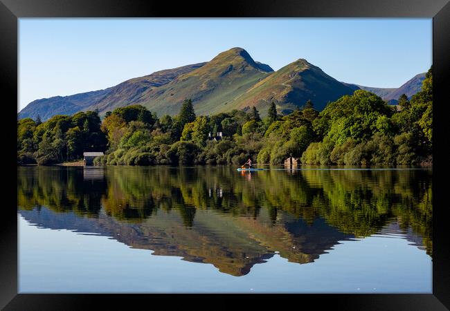 Paddling the Lakes Framed Print by Roger Green