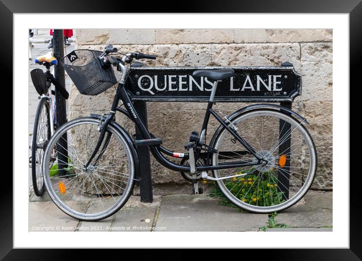 Bicycle locked to the street sign for Queen's Lane, Oxford, Framed Mounted Print by Kevin Hellon