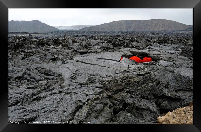 Glimpses of lava in a black lava field in Iceland Framed Print by Lensw0rld 