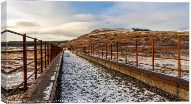 A snow covered old railway viaduct at the Big Water of Fleet at the Cairnsmore Canvas Print by SnapT Photography