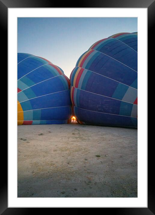 Coloful air hot air balloons facing each other being filled with helium gas during night, preparation of a flight in Goreme national park in Cappadocia, Turkey Framed Mounted Print by Arpan Bhatia
