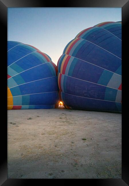 Coloful air hot air balloons facing each other being filled with helium gas during night, preparation of a flight in Goreme national park in Cappadocia, Turkey Framed Print by Arpan Bhatia