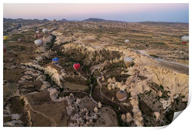 Many colorful hot air balloons flight above mountains and rocky formation - panorama of Cappadocia at sunrise. Wide landscape of Goreme valley - billboard background for your travel concept in Turkey Print by Arpan Bhatia