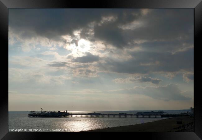 Evening sun and clouds at Brighton Pier, West Sussex, England Framed Print by Phil Banks