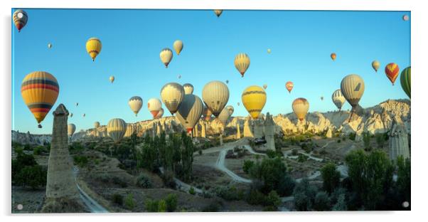 Panorama of bunch of colorful hot air balloon flying early morning in Cappadocia, Turkey against typical rock formation due to volcanic activity in love valley located in Goreme national park Acrylic by Arpan Bhatia