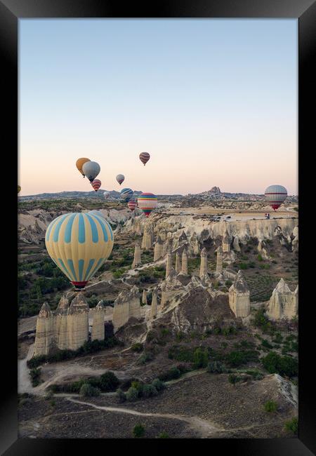 Colorful hot air balloons in the sunrise autumn morning. Goreme National Park, Cappadocia, Turkey. Aerial view Framed Print by Arpan Bhatia
