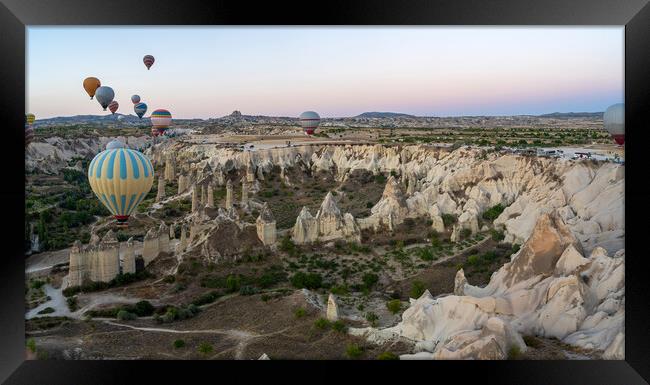 Hot Air balloons flying tour over Mountains landscape geological rock formation in autumn during sunrise in Cappadocia, Goreme National Park, Turkey nature background Framed Print by Arpan Bhatia