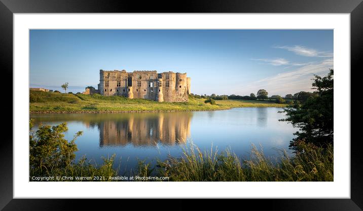 Carew Castle reflected by the evening sun  Framed Mounted Print by Chris Warren