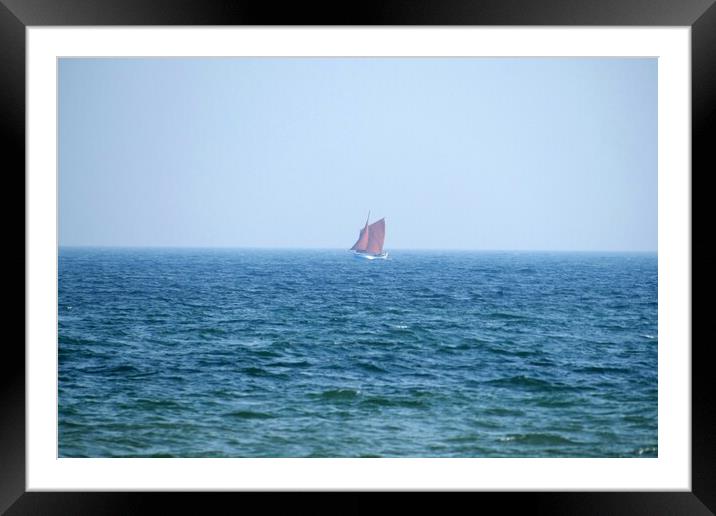 Lone red sailing boat Framed Mounted Print by Roy Hinchliffe