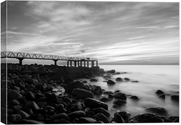 Sunrise next to a rocky beach in black and white Canvas Print by Vicen Photo