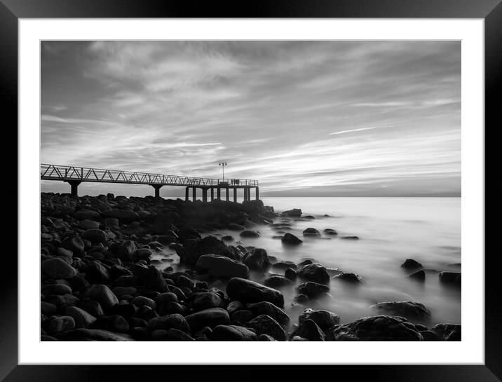 Sunrise next to a rocky beach in black and white Framed Mounted Print by Vicen Photo