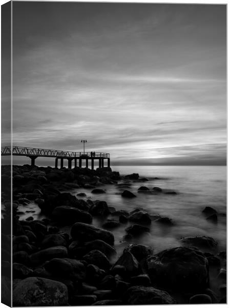 Dark sunrise on the pebble beach in black and white Canvas Print by Vicen Photo