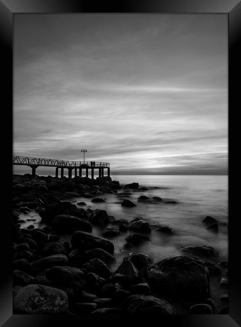 Dark sunrise on the pebble beach in black and white Framed Print by Vicen Photo