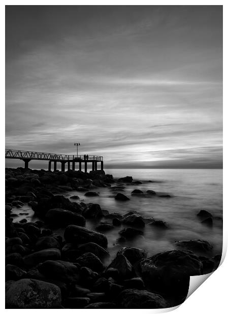 Dark sunrise on the pebble beach in black and white Print by Vicen Photo