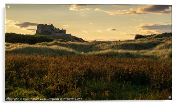 Majestic Bamburgh Castle at Golden Hour Acrylic by Clive Ingram