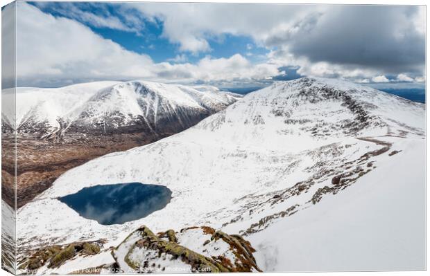 Winter view of Ben Macdui, Cairn Toul and Lochan Uaine, Cairngorms Canvas Print by Justin Foulkes