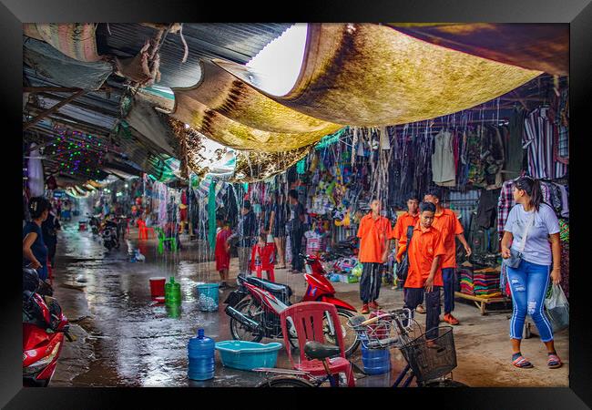 When the big Rain comes to the Chongchom Market in Surin somewhere in Isan Thailand Framed Print by Wilfried Strang