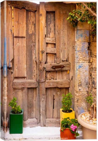 Colourful plant containers and old wooden doors, Canvas Print by Kevin Hellon