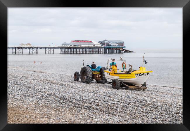 Fishing boat being recovered at Cromer Framed Print by Jason Wells