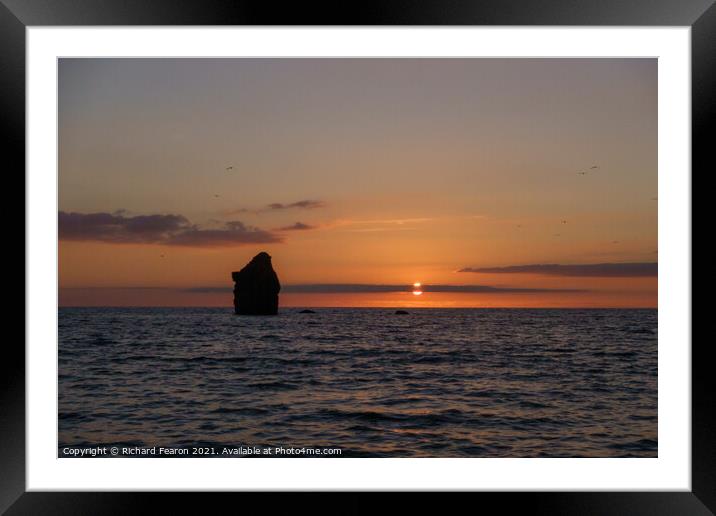 Warm sun setting at Thurlestone Rock Framed Mounted Print by Richard Fearon