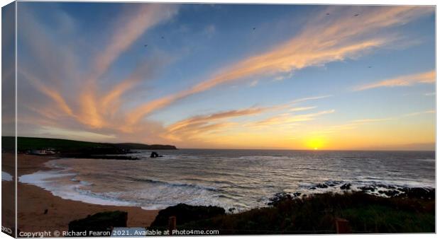 Thurlestone rock, sunset with clouds swirling in t Canvas Print by Richard Fearon