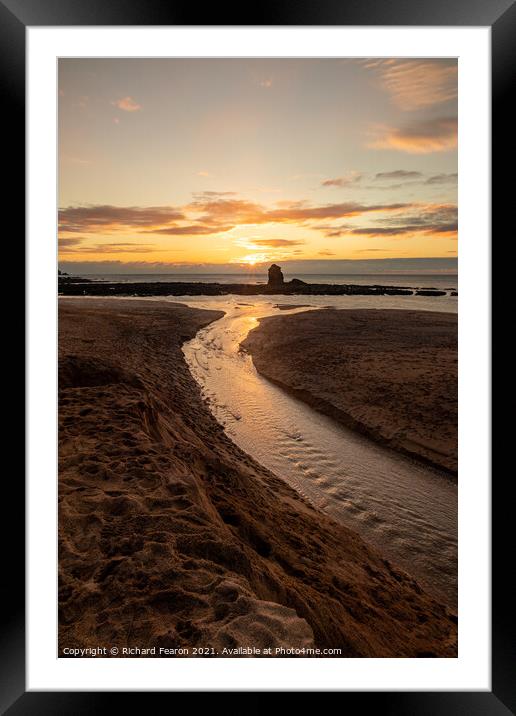 Sun setting behind the rock at Thurlestone. Framed Mounted Print by Richard Fearon