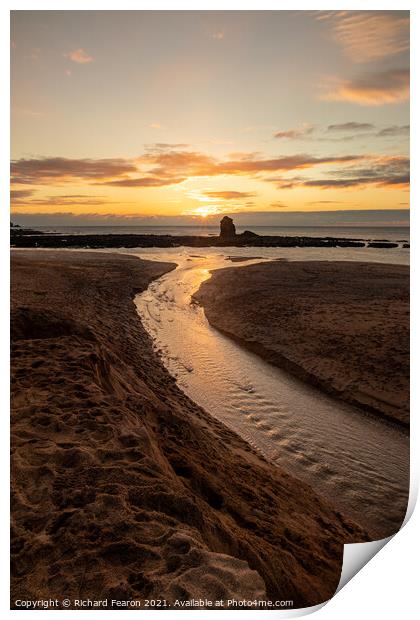 Sun setting behind the rock at Thurlestone. Print by Richard Fearon