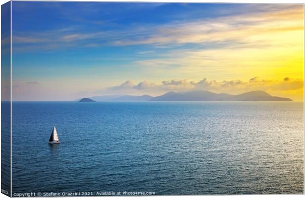 Elba island sunset view and sail boat Canvas Print by Stefano Orazzini